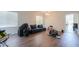 Bright living room with hardwood floors, ample space, and an open layout, ready for customization at 44115 W Palmen Dr, Maricopa, AZ 85138