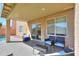 Patio featuring outdoor seating, string lights, and a view of the pool and backyard at 44115 W Palmen Dr, Maricopa, AZ 85138