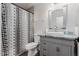 This bathroom features an updated vanity and mirror as well as shower and toilet with neutral color palette at 44165 W Kramer Ln, Maricopa, AZ 85138