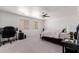 Bedroom with carpet, ceiling fan, and windows allowing for natural light at 44165 W Kramer Ln, Maricopa, AZ 85138
