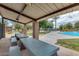 Covered picnic area with tables and splash pad nearby, ideal for community gatherings and Gathering fun at 44165 W Kramer Ln, Maricopa, AZ 85138