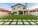 Spacious backyard showcasing lush artificial turf and stylish stone pavers, perfect for outdoor entertaining at 4720 E Adobe Dr, Phoenix, AZ 85050