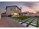 Well-maintained backyard featuring artificial turf, stone pavers, and desert landscaping, perfect for outdoor enjoyment at 4720 E Adobe Dr, Phoenix, AZ 85050