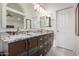Modern bathroom boasts granite counters, dual sinks, stylish cabinetry, and sleek fixtures at 4720 E Adobe Dr, Phoenix, AZ 85050