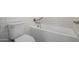 Bright bathroom featuring a white toilet, bathtub, and tiled wall at 4720 E Adobe Dr, Phoenix, AZ 85050