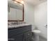 Bathroom featuring a vanity with granite countertop and a wood framed mirror at 4720 E Adobe Dr, Phoenix, AZ 85050