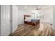 Bright bedroom featuring wood floors, a ceiling fan, and a built-in bed frame with storage drawers at 4720 E Adobe Dr, Phoenix, AZ 85050