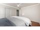 Bedroom featuring ceiling fan, wood floors, bed and lots of space at 4720 E Adobe Dr, Phoenix, AZ 85050