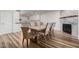 Dining room with hardwood floors, stylish chairs, and a view into a modern kitchen at 4720 E Adobe Dr, Phoenix, AZ 85050