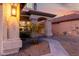 Inviting covered front entrance featuring stone pillars and desert landscaping at 4720 E Adobe Dr, Phoenix, AZ 85050