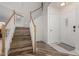 Welcoming foyer showcasing a beautiful staircase and a convenient coat closet near the entrance at 4720 E Adobe Dr, Phoenix, AZ 85050