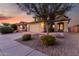 Two-story home features desert landscaping, a large two-car garage, and covered entry way at 4720 E Adobe Dr, Phoenix, AZ 85050