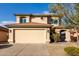 Charming two-story home with a two car garage, tile roof, and landscaped front yard at 4720 E Adobe Dr, Phoenix, AZ 85050