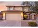 Charming two-story home featuring a neutral exterior, a two-car garage, and manicured landscaping at 4720 E Adobe Dr, Phoenix, AZ 85050