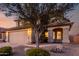 A two-story home with desert landscaping, a two-car garage, and inviting front entrance at 4720 E Adobe Dr, Phoenix, AZ 85050