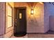 Inviting front door with decorative glass and a stylish lantern lighting fixture at 4720 E Adobe Dr, Phoenix, AZ 85050