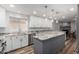 Bright kitchen with white cabinets, granite counters, stainless appliances, and a center island with breakfast bar at 4720 E Adobe Dr, Phoenix, AZ 85050
