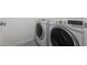 Modern laundry room featuring a white washer and dryer set, ideal for convenient home upkeep at 4720 E Adobe Dr, Phoenix, AZ 85050
