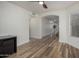 This home has spacious wood laminate floors leading to an archway and an open layout for modern living at 4720 E Adobe Dr, Phoenix, AZ 85050