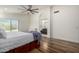 Bedroom featuring an ensuite bathroom, ceiling fan, and wood flooring at 4720 E Adobe Dr, Phoenix, AZ 85050