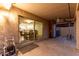 The outdoor patio features a sliding glass door that looks to the kitchen and dining area at 4720 E Adobe Dr, Phoenix, AZ 85050