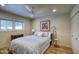 Cozy bedroom featuring a comfortable queen bed, ceiling fan and natural light at 536 W Surrey Ave, Phoenix, AZ 85029