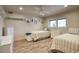 Bright bedroom featuring twin beds, wood floors and recessed lighting at 536 W Surrey Ave, Phoenix, AZ 85029