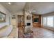 Inviting living room with stone fireplace, built-in bookshelves, and a large window at 536 W Surrey Ave, Phoenix, AZ 85029