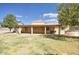 Back patio with grass and BBQ, perfect for relaxation and outdoor dining at 536 W Surrey Ave, Phoenix, AZ 85029