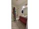 Bathroom featuring a red vanity, tile floors, modern fixtures, and a shower with colorful curtain at 5429 N Black Cyn Hwy, Phoenix, AZ 85015