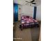 Comfortable bedroom with a cozy bed, decorative shelves, and plenty of space at 5429 N Black Cyn Hwy, Phoenix, AZ 85015