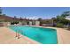 Large community pool with lots of seating surrounded by townhomes at 5429 N Black Cyn Hwy, Phoenix, AZ 85015