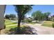 Beautifully landscaped courtyard with lush green grass, mature trees, and walking paths at 5429 N Black Cyn Hwy, Phoenix, AZ 85015