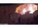 Cozy fire pit with stone surround and gravel creates inviting atmosphere at 5429 N Black Cyn Hwy, Phoenix, AZ 85015