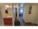 Hallway leading to bedroom, with a bathroom and decorative chest along the way at 5429 N Black Cyn Hwy, Phoenix, AZ 85015