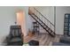 Relaxing living room with a unique staircase, comfortable seating, and contemporary accents at 5429 N Black Cyn Hwy, Phoenix, AZ 85015