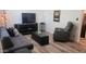 Cozy living room with modern decor, a comfortable sofa, and stylish entertainment center at 5429 N Black Cyn Hwy, Phoenix, AZ 85015