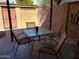Enclosed outdoor seating area with modern table and chairs on concrete patio with privacy walls at 5429 N Black Cyn Hwy, Phoenix, AZ 85015