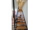 Bright staircase with wooden steps and a black metal railing, leading to the upper level at 5429 N Black Cyn Hwy, Phoenix, AZ 85015