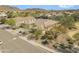 Aerial shot of a home, showcasing desert landscaping in a neighborhood with mountain views at 5721 W Molly Ln, Phoenix, AZ 85083