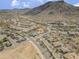 Expansive aerial view of a residential neighborhood with desert landscaping and mountain backdrop at 5721 W Molly Ln, Phoenix, AZ 85083