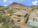 A desert home showcases a covered patio, green space, swimming pool, and mountain views at 5721 W Molly Ln, Phoenix, AZ 85083