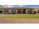 Backyard with putting green and covered patio, perfect for outdoor enjoyment at 5721 W Molly Ln, Phoenix, AZ 85083