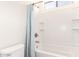 Clean white bathroom featuring a shower-tub combination with a light blue shower curtain at 5721 W Molly Ln, Phoenix, AZ 85083