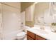 Bright bathroom with a shower-tub combo, single sink vanity, and decorative art at 5721 W Molly Ln, Phoenix, AZ 85083