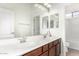 Bathroom with double sinks, ample counter space, and large mirrors at 5721 W Molly Ln, Phoenix, AZ 85083