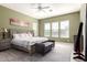 Serene primary bedroom featuring abundant natural light, neutral decor, and complemented by tasteful accents at 5721 W Molly Ln, Phoenix, AZ 85083
