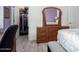 Bedroom with dresser, bed, and closet space perfect for relaxation at 5721 W Molly Ln, Phoenix, AZ 85083