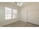 Inviting bedroom with wood-look floors, large windows, and a spacious closet at 5721 W Molly Ln, Phoenix, AZ 85083