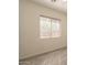 Bedroom featuring light grey vinyl floors, white walls, and window with blinds at 5721 W Molly Ln, Phoenix, AZ 85083